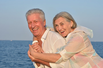 elderly couple rest at tropical resort