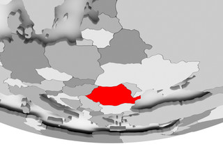 Map of Romania on grey political globe
