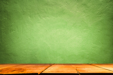 Green Concrete texture backdrop with wooden shelf