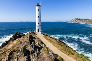 Rolgordijnen Vuurtoren Lighthouse at Cabo Home, an iconic cape in Cangas, Pontevedra, Galicia, Spain