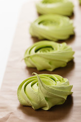 Home baked green meringues cookies