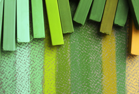 Bright green chalk on colorful background