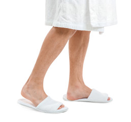 Man in bathing slippers on white background