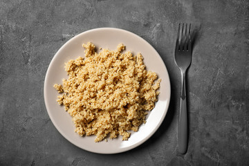 Cooked quinoa on grey background
