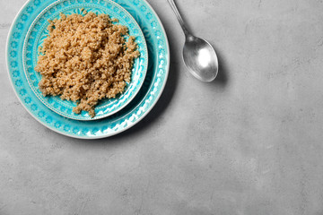 Cooked quinoa on grey background