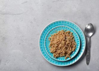 Cooked quinoa on grey background