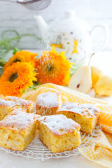 Home pear charlotte on a white dish, selective focus