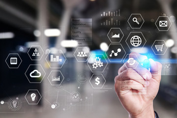 Business and technology concept. Graphs and icons on virtual screen background.