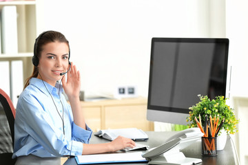 Young female receptionist in office