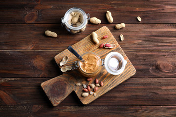 Composition with peanut butter on wooden table