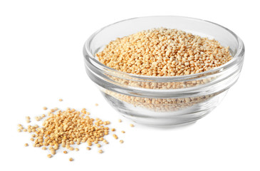 Raw quinoa in glass bowl isolated on white