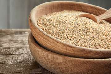 White quinoa in bowl on kitchen table