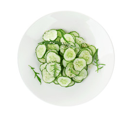 Fresh cucumber salad on plate, isolated on white
