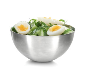 Healthy salad with cucumbers and eggs in bowl, isolated on white