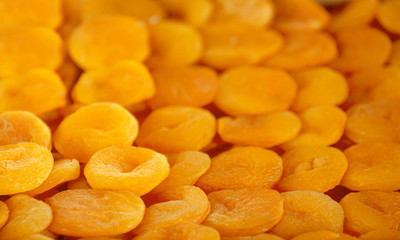 Delicious dried apricots as background