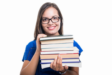 Portrait of student girl holding books and smiling