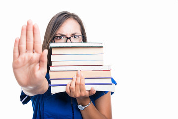 Student girl holding books showing stop covering face