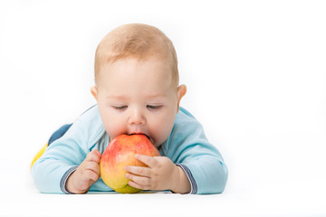 Fototapeta na wymiar kid with an apple on a white background