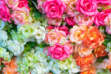 Rose fake flower and Floral background. rose flowers made of fabric. The fabric flowers bouquet. Colorful of decoration artificial flower