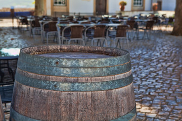 Old wooden barrel standing on the ground