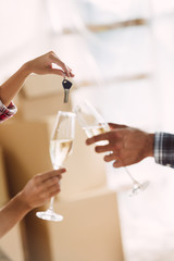 couple drinking champagne in new house