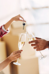 couple drinking champagne in new house