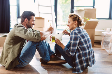 couple eating in new house