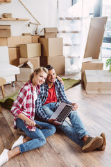 couple using laptop