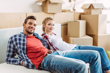 couple resting in new house