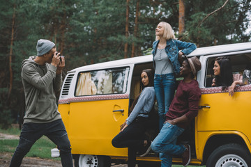 friends taking photo at camera