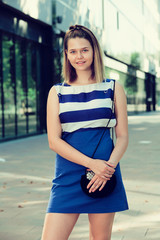 Obraz premium Portrait of girl enjoying walk along city streets