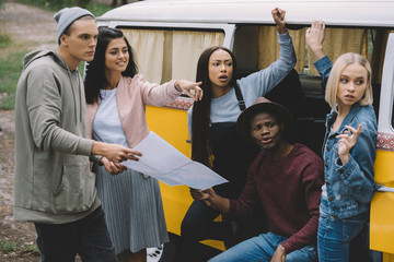 travelers with map showing the way