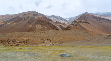 Mountain tops, covered with clouds and fog on the Chang La Pass
