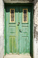 Old green wooden door on Santorini.