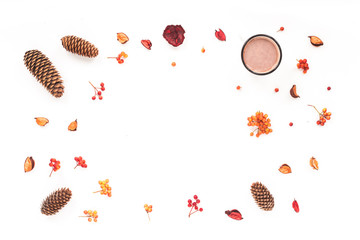 Autumn workplace. Pine cone, cup of coffee, viburnum berry, dried flowers, marshmallow on white background. Flat lay, top view. Autumn background