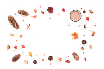Autumn workplace. Pine cone, cup of coffee, viburnum berry, dried flowers, marshmallow on white background. Flat lay, top view. Autumn background