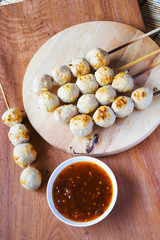 Pork meatballs dish on wood plate