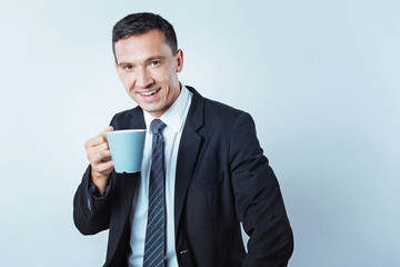 Successful businessman drinking coffee