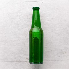 A bottle of beer. Top view. Free space for text.