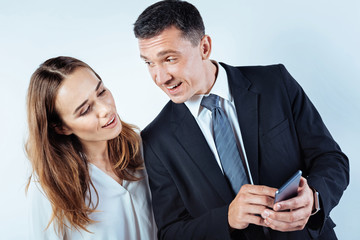 Relaxed colleagues talking over something together