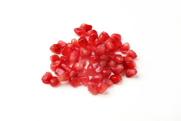 Pomegranate seeds on a white background