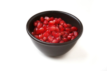 Pomegranate seeds on a white background