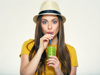 portrait of young woman drinking juice