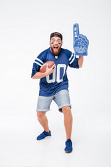 Screaming man fan in blue t-shirt standing isolated