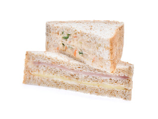 sandwich with ham, tuna and vegetables on white background