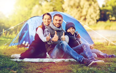 happy family with tent at camp site