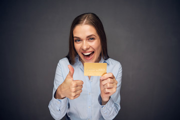 Business woman funny portrait with credit card.