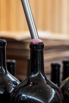 Close up of wine being bottled