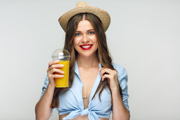 Modern beautiful girl holding orange juice glass.