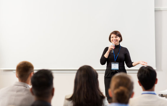 group of people at business conference or lecture